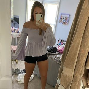 Purple, tight to loose fitting shirt